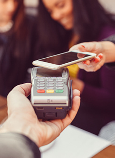 A person doing a payment with a cellphone